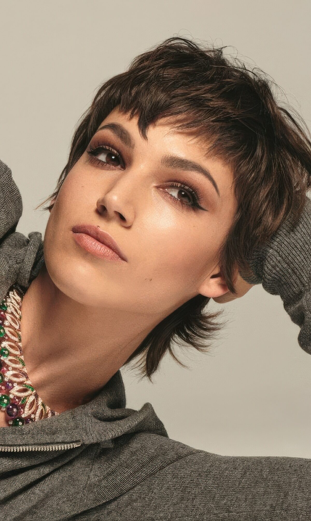 A lovely short brunette mullet with bangs and a bit of volume is a super cool and chic idea.