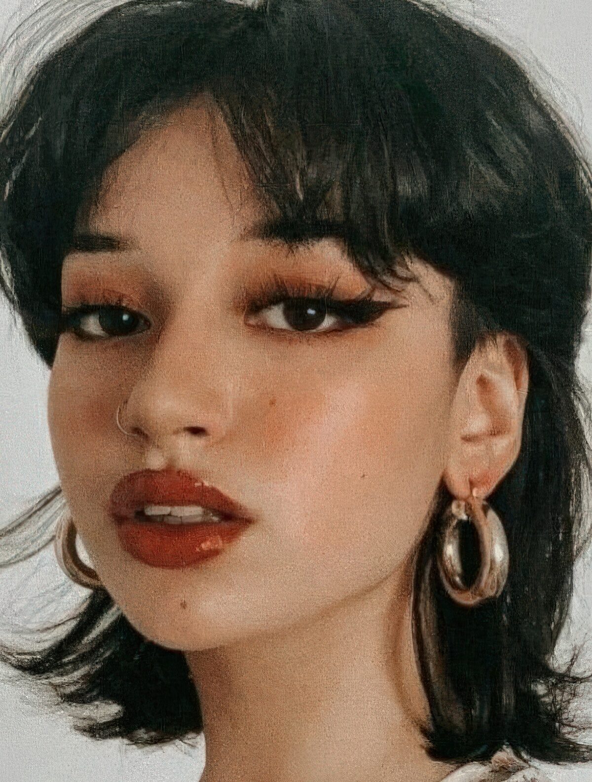 A mullet with bangs like here can be used to soften the cut or to emphasize the disconnection.