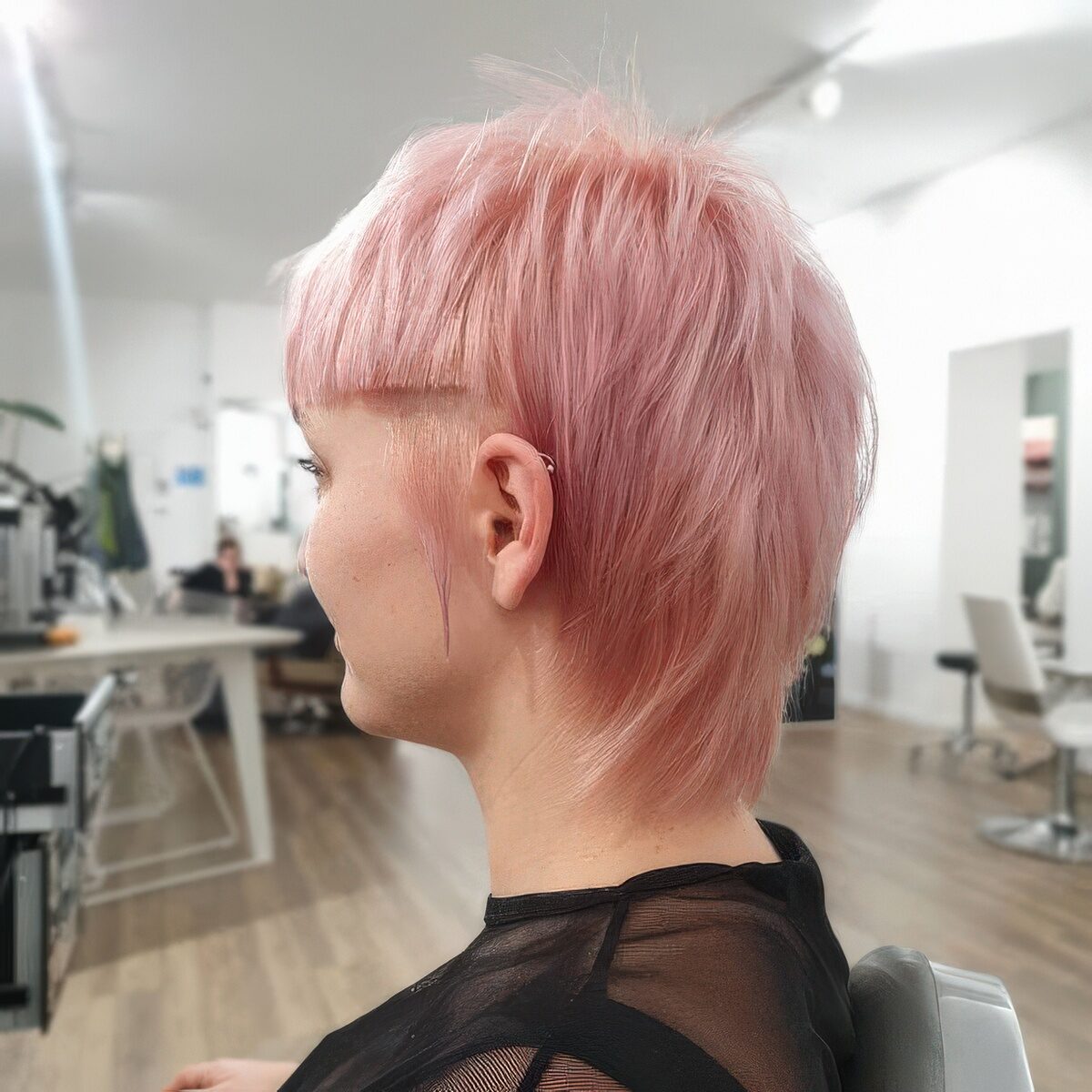 A pastel pink straight hair short mullet with sharp line bangs is a bold solution for those who are ready to make a statement.