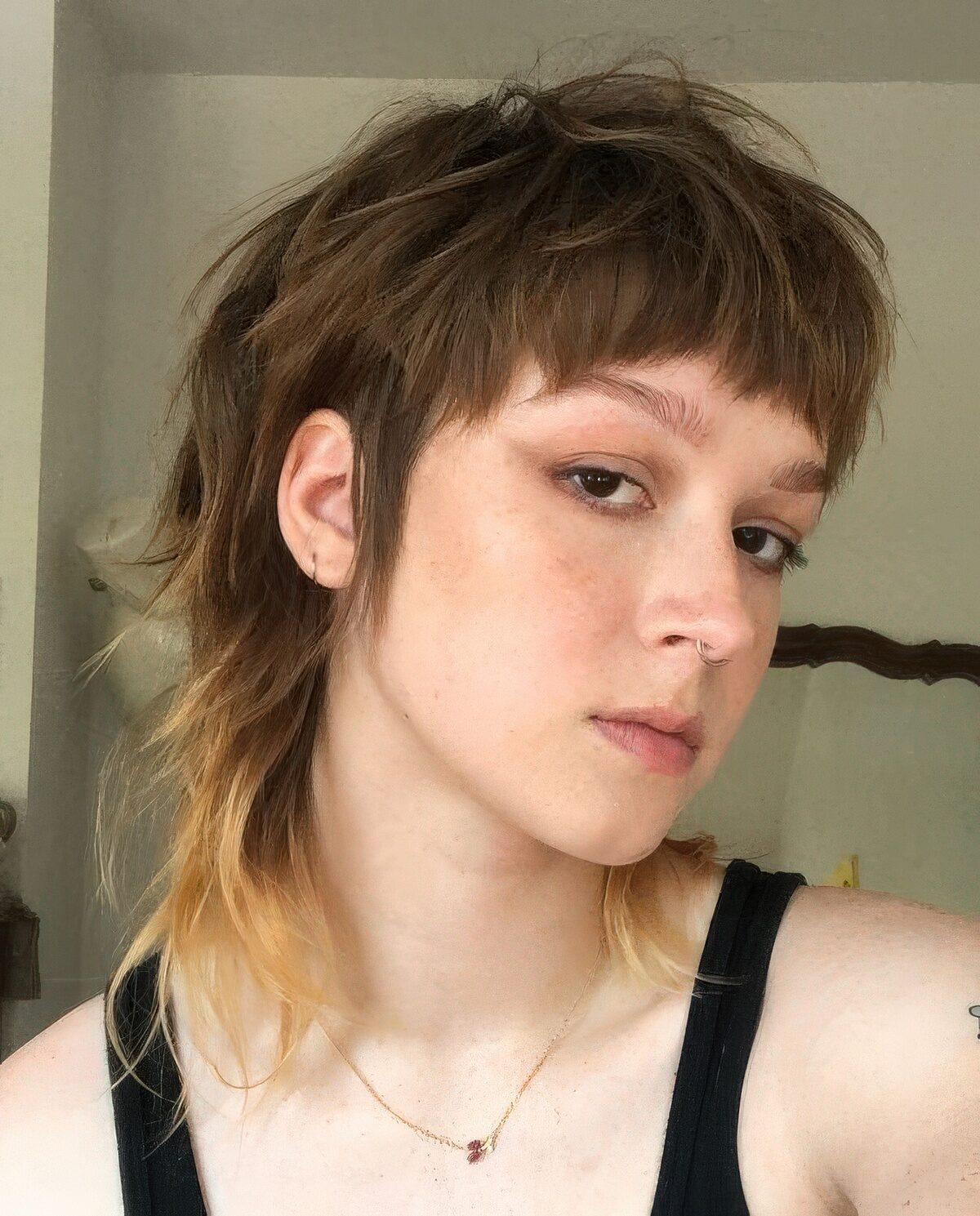 A short brunette mullet with long sides, bangs and an ombre blonde touch at the ends is amazing.