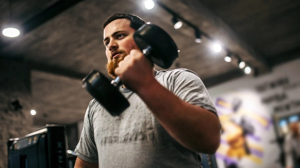 A man lifting weights. 