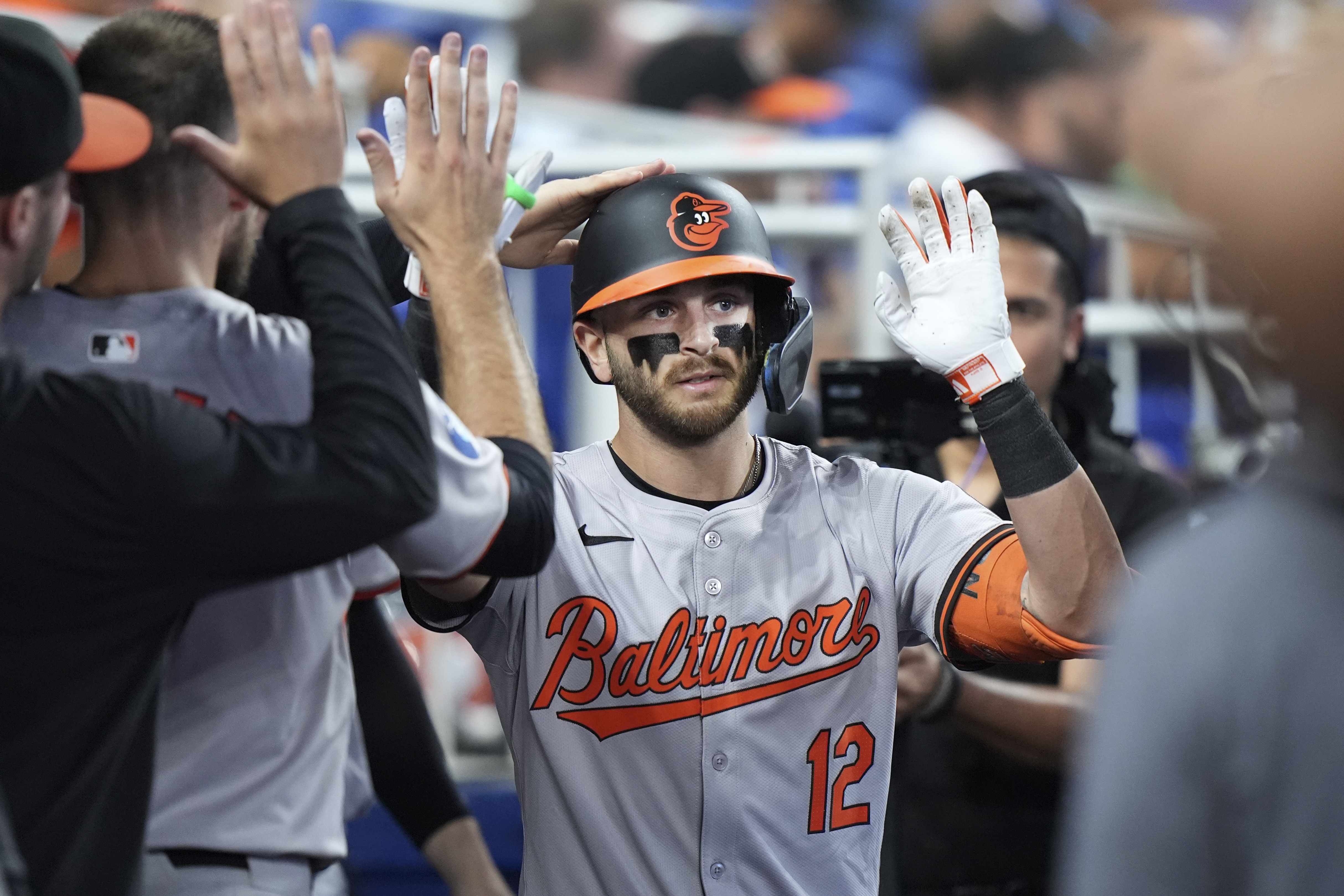 Baltimore Orioles' Connor Norby is congratulated by teammates after he hit a home run during the fourth inning of a baseball game against the Miami Marlins, Thursday, July 25, 2024, in Miami. (AP Photo/Wilfredo Lee)