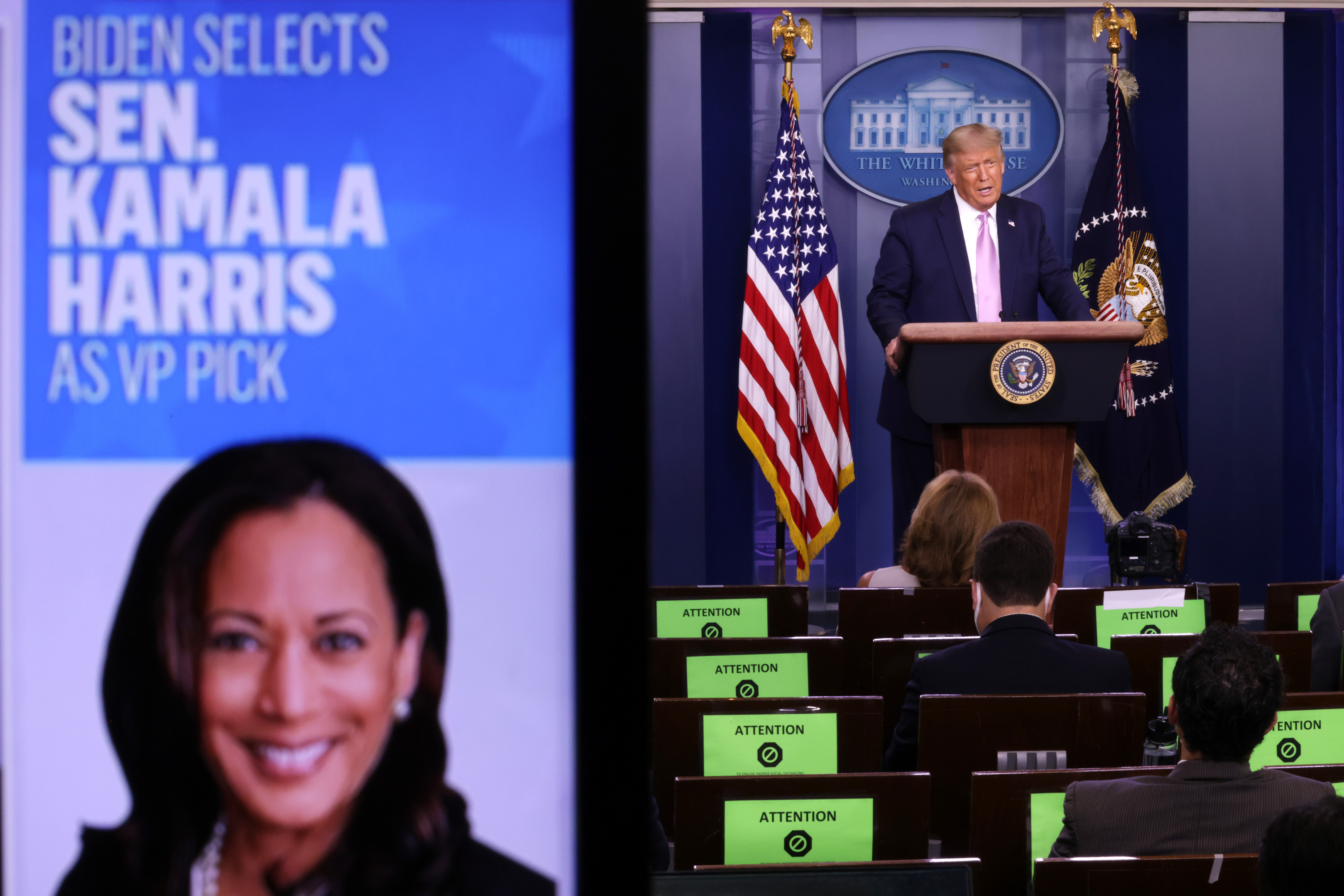 File photo of then President Donald Trump speaking as a picture of Sen. Kamala Harris (D-CA) is seen on a screen during a news conference in the James Brady Press Briefing Room of the White House August 11, 2020 in Washington, DC. (Photo by Alex Wong/Getty Images)