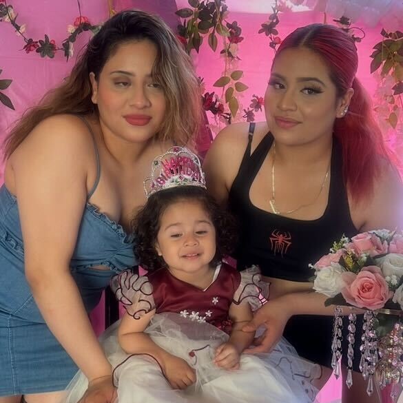 Giselle Flores, left, and Sharick Flores, right with their baby sister. (Courtesy of the victim's family)