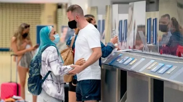 people say goodbye at airport