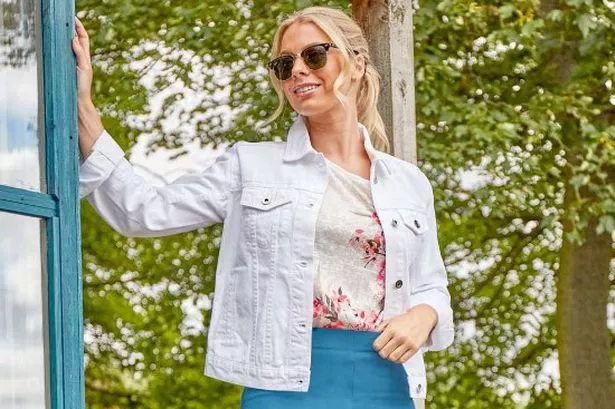 model wearing white denim jacket