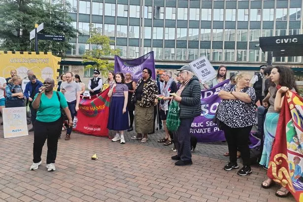 Protesters rallying against the planned redundancies outside Lewisham town hall in Catford, South East London