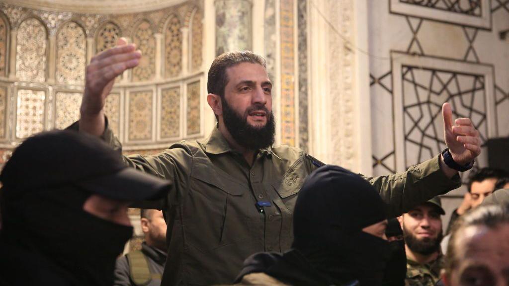 Hayat Tahrir al-Sham (HTS) leader Abu Mohammed al-Jolani speaks to a crowd at the Umayyad Mosque in Damascus, Syria, after the overthrow of President Bashar al-Assad (8 December 2024)