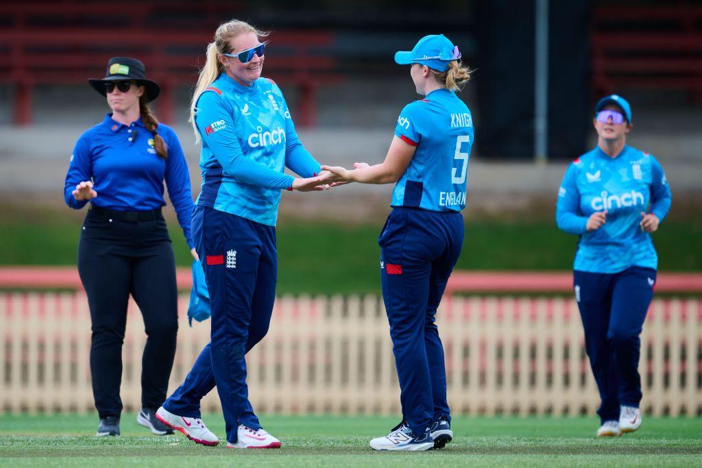 England left-arm spinner celebrates taking a wicket with captain Heather Knight