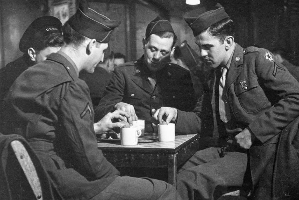 A photo taken on 27 January 1944 of American soldiers enjoying a drink at Rainbow Corner, the American Red Cross club for servicemen in London's Piccadilly, during World War Two