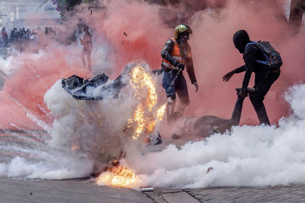 A gas canister explodes at protests on Tuesday.