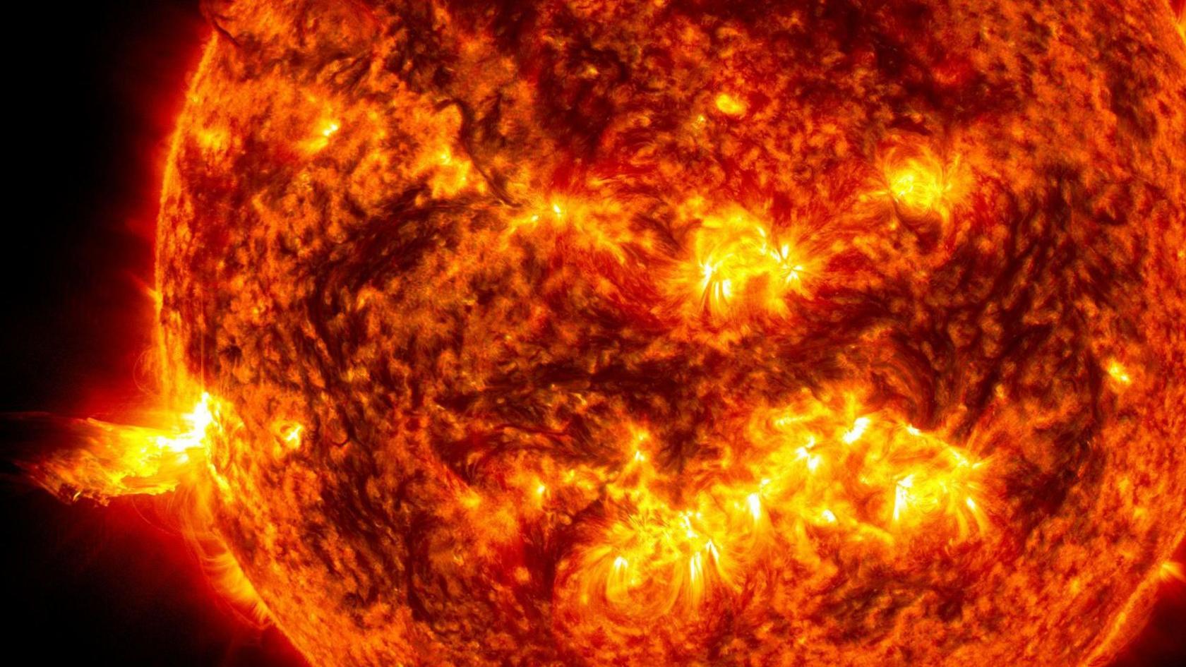 Close up of the Sun showing an eruption of solar material shooting through the Sun's atmosphere