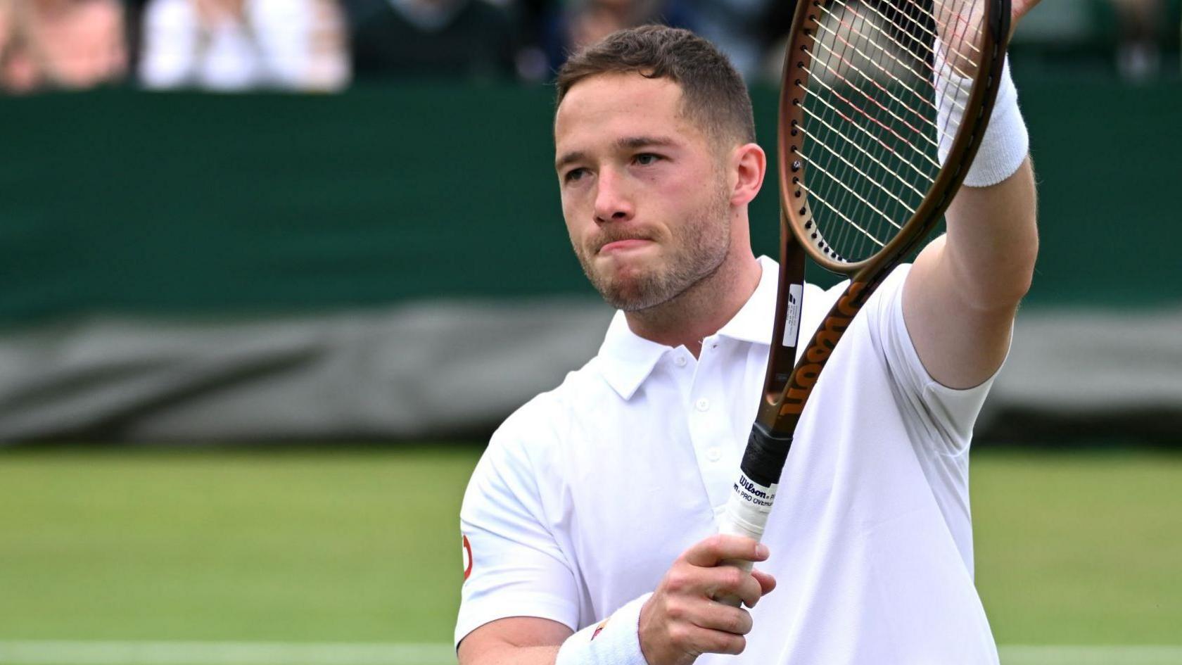 Alfie Hewett claps his racquet towards the Wimbledon crowd