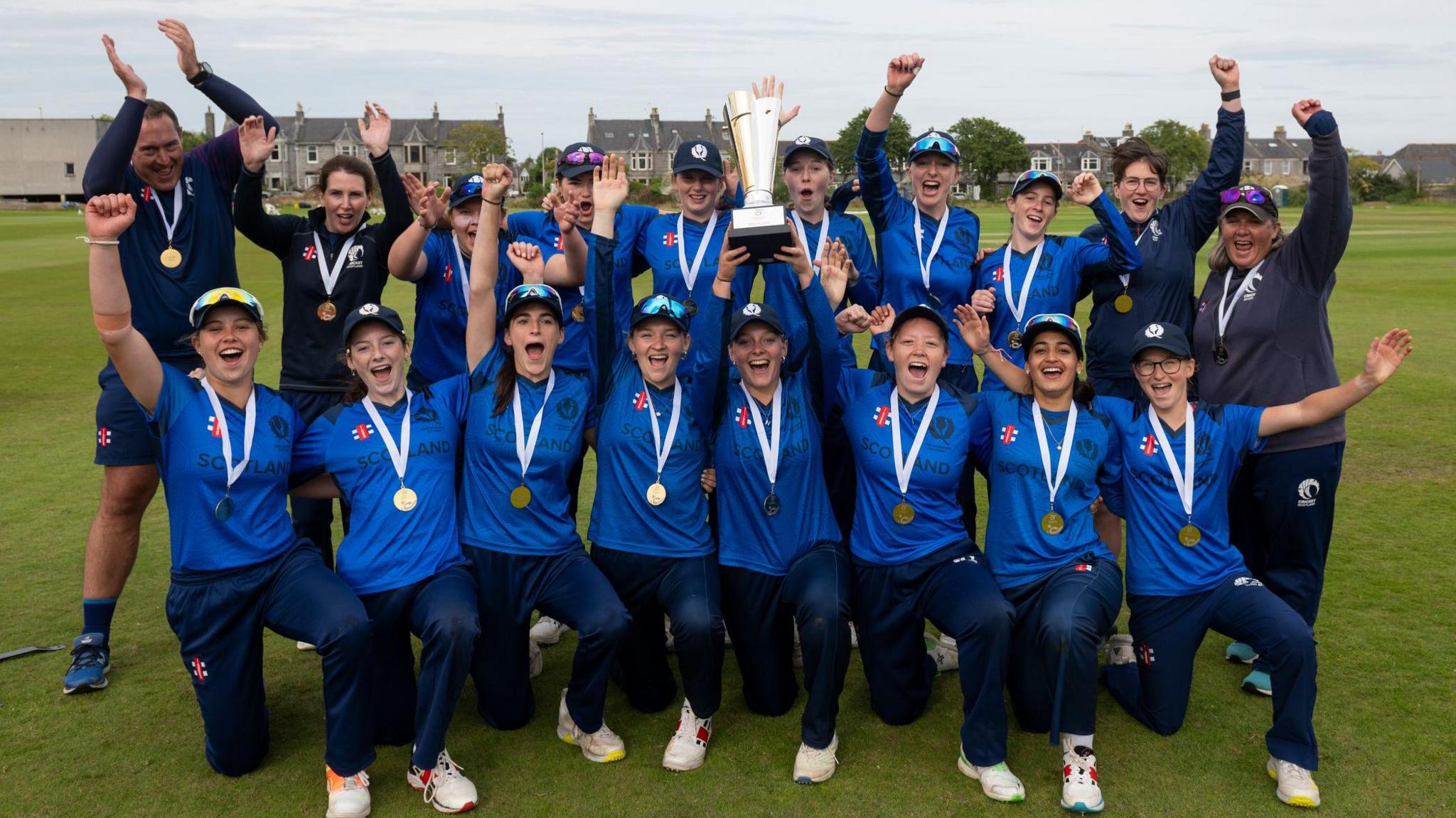 The Scotland women's Under 19 T20 squad celebrate their qualification for the World Cup