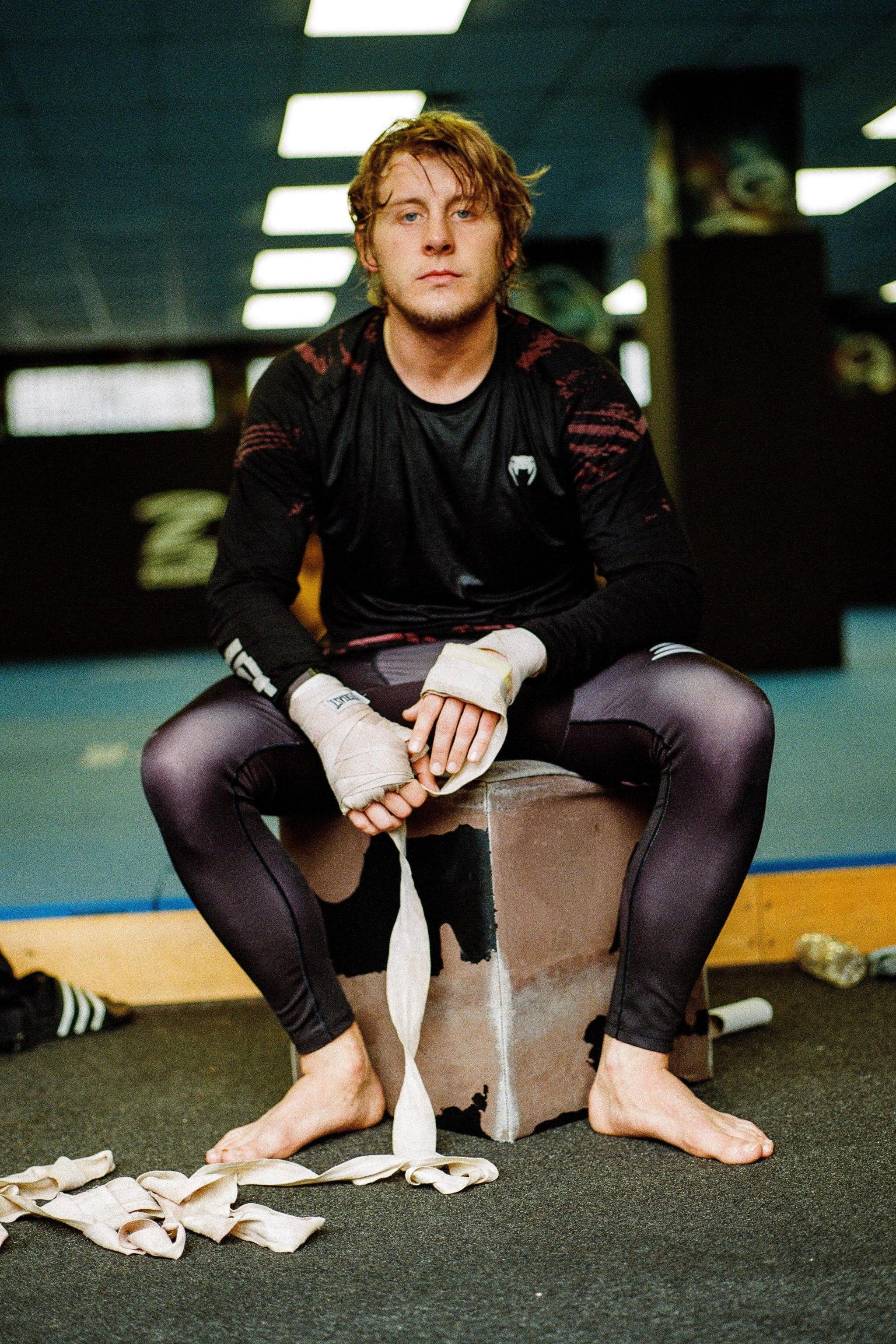 Paddy Pimblett takes off his hand wraps in his Liverpool gym