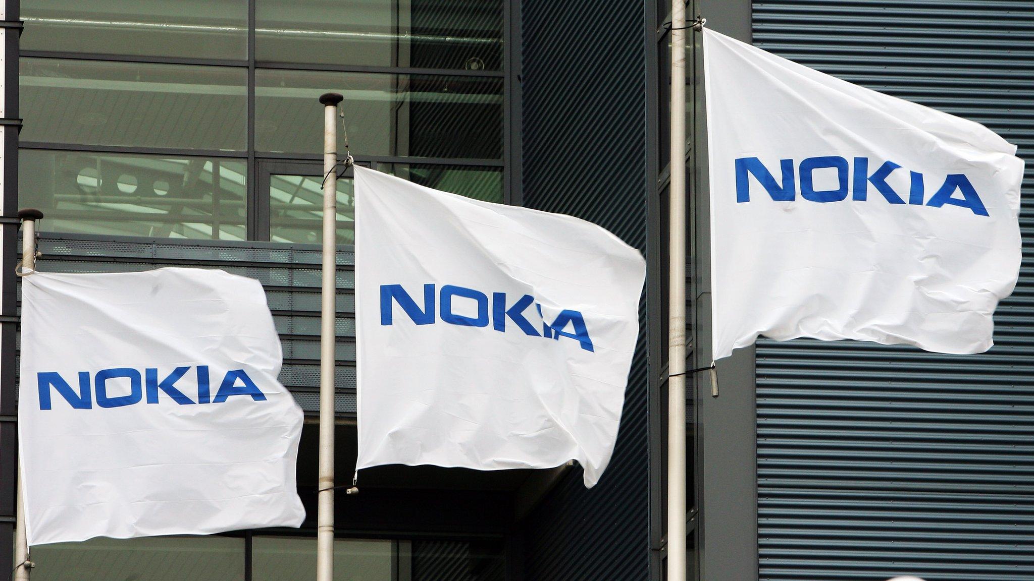 Nokia flags at the company's headquarters