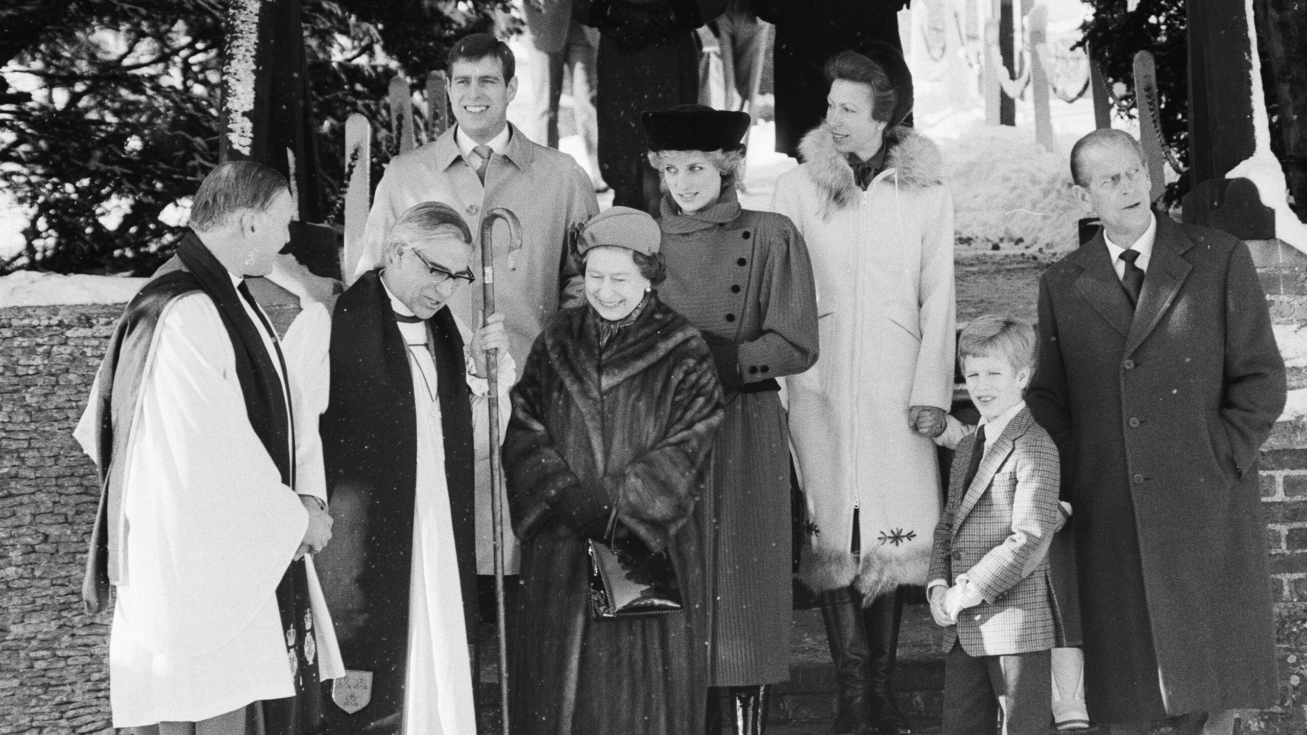 DECEMBER 25: (L-R) Prince Andrew, Duke of York, Queen Elizabeth II, Diana, Princess of Wales, wearing a red military style coat designed by Piero de Monz, a black velvet crowned hat designed by Marina Killery and a Russian style black muff, Anne, Princess Royal, Peter Phillips and Prince Philip, Duke of Edinburgh. They all leave St Mary Magdalene Church after attending the Christmas Day service on December 25, 1985 in Sandringham, United Kingdom