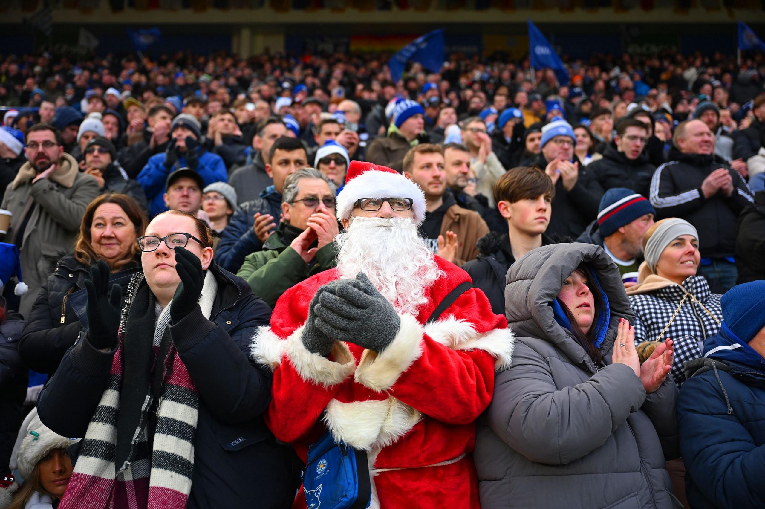 A fan of Leicester City is seen in the stands, wearing fancy dress prior to the Premier League match between Leicester City and Wolverhampton Wanderers at The King Power Stadium