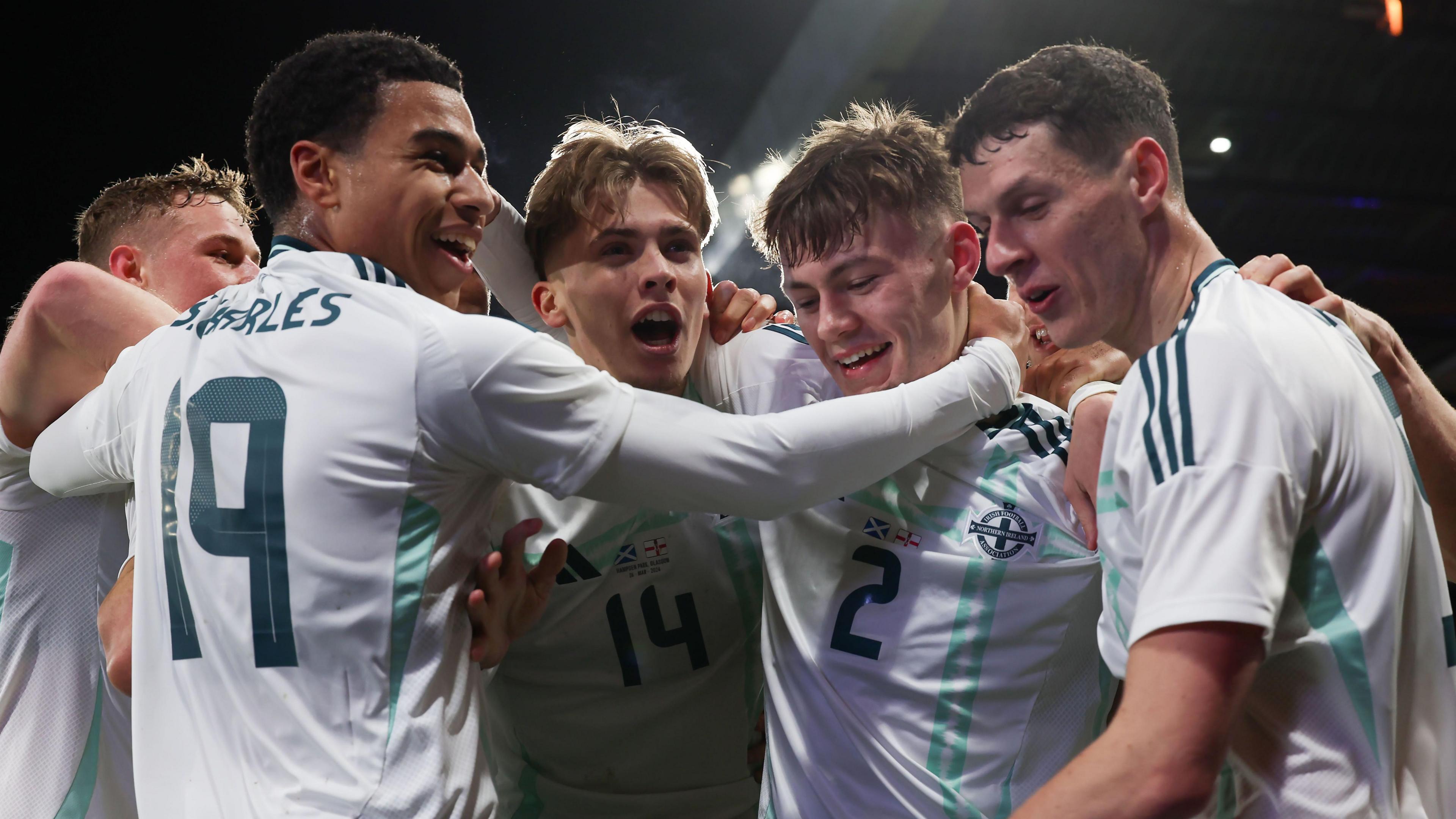 Northern Ireland players celebrate Conor Bradley's goal against Scotland