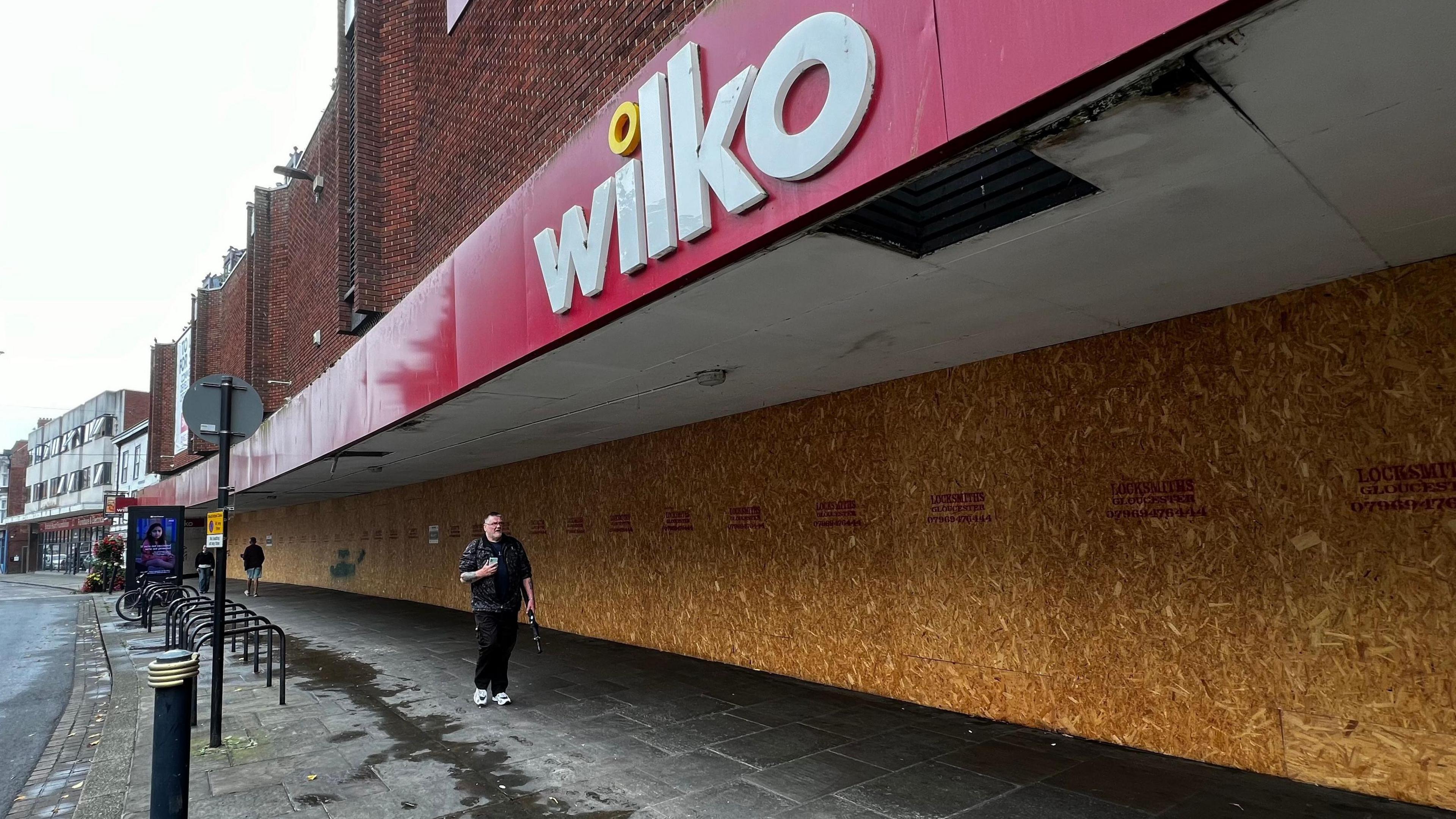 The huge Wilko store in Gloucester. The logo is still painted on the big red shopfront, but the windows are all boarded up