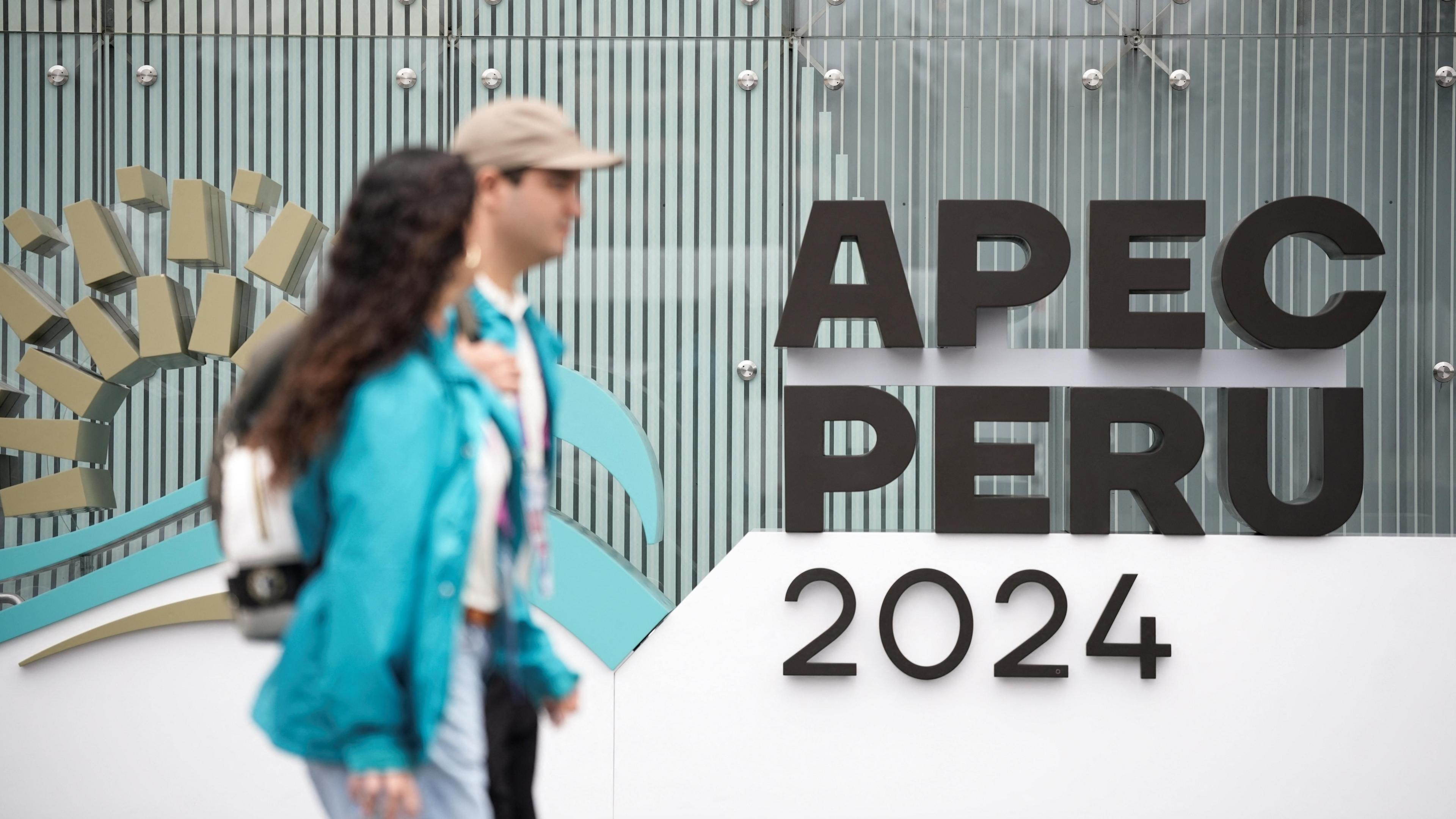 People walk at the venue of the Asia-Pacific Economic Co-operation (Apec) summit in Lima, Peru