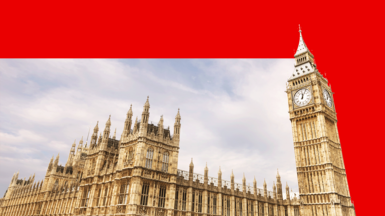 The Houses of Parliament with a blue sky behind it, with a red border around the top and right-hand-side of the image