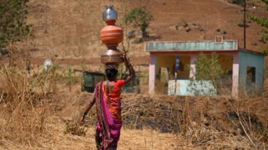 Women carrying water in India