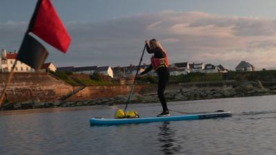 Paddleboarder in the sea