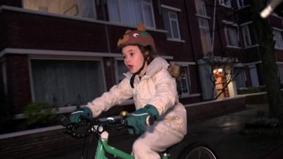 Girl cycling on her bike in the Netherlands