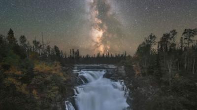 Our Milky Way at night over a waterfall in Canada