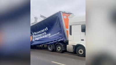 The truck's trailer was badly damaged in the crash