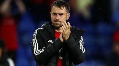 Wales' attacking midfielder Aaron Ramsey applauds fans