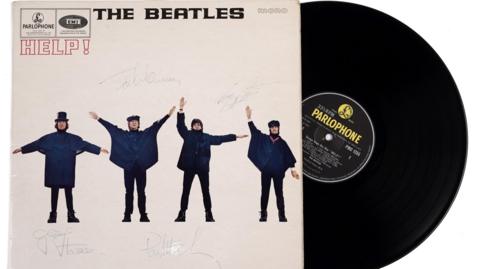 The signed LP cover of Help! by The Beatles.