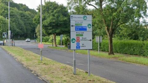 A road sign showing directions to the city centre, the ring road and to Bradford Royal Infirmary