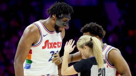 Joel Embiid, of the Philadelphia 76ers, confronts referee Jenna Schroeder in his side's win against the San Antonio Spurs