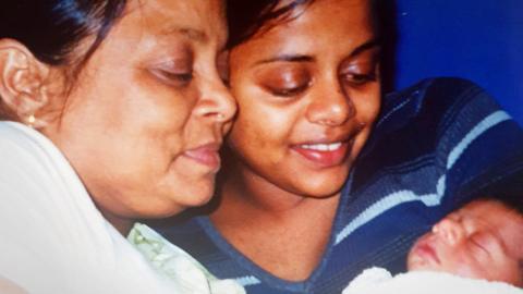 Runi admires her three-day-old grandson Omar in Farah's arms