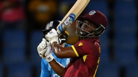 Evin Lewis hits a boundary