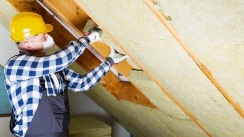 Loft insulation being installed