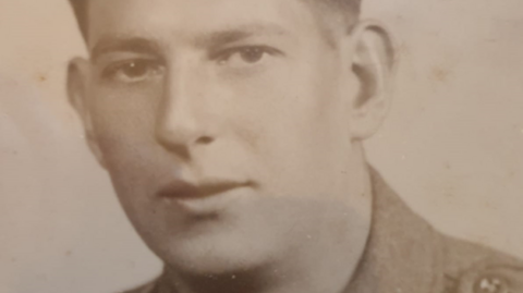 A black and white portrait photograph of Pte Henry Moon