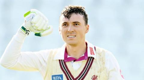 Tom Banton celebrates his century for Somerset against Surrey