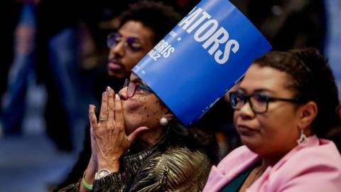 Supporters of US Vice President Kamala Harris watch US 2024 presidential election results returns at a Georgia Democratic Party election night party in Atlanta, Georgia