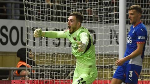 Leyton Orient keeper Josh Keeley celebrates scoring his side's equaliser against Oldham