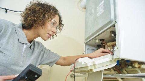 Engineer inspecting a boiler