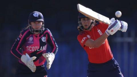 England opener Maia Bouchier hooks a short ball as Scotland wicketkeeper Sarah Bryce watches on