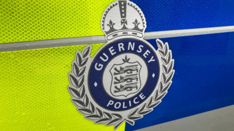 Guernsey Police logo on the side of a police car