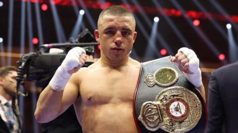 Nick Ball with the WBA world title belt in the ring after a fight