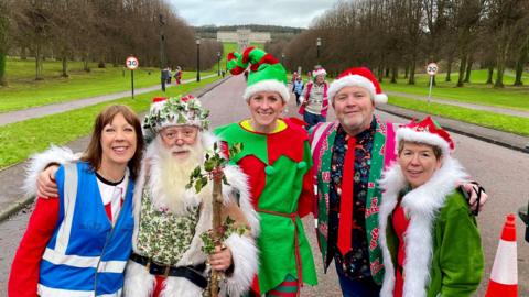 Stormont Parkrun race director Marianne Hood, Jimmy McNeilly dressed as Santa, event director Alison Canning, Gary Craig and Una McNeill, at the Christmas Day Parkrun on the Stormont Estate in Belfast