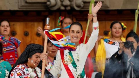 Mexico's new President Claudia Sheinbaum holds the "baton of command" during a ceremony at Zocalo Square in Mexico City, Mexico October 1, 2024.