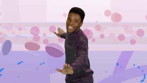 Presenter Rhys Stephenson dancing on a purple backdrop.