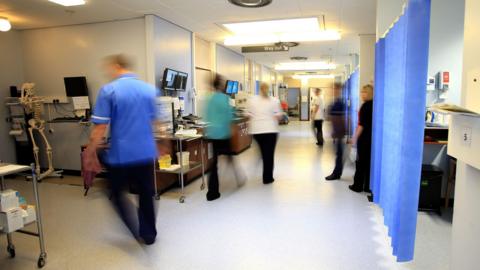 NHS staff in a busy hospital ward